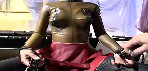  Girl in latex is an object in the hands of her master